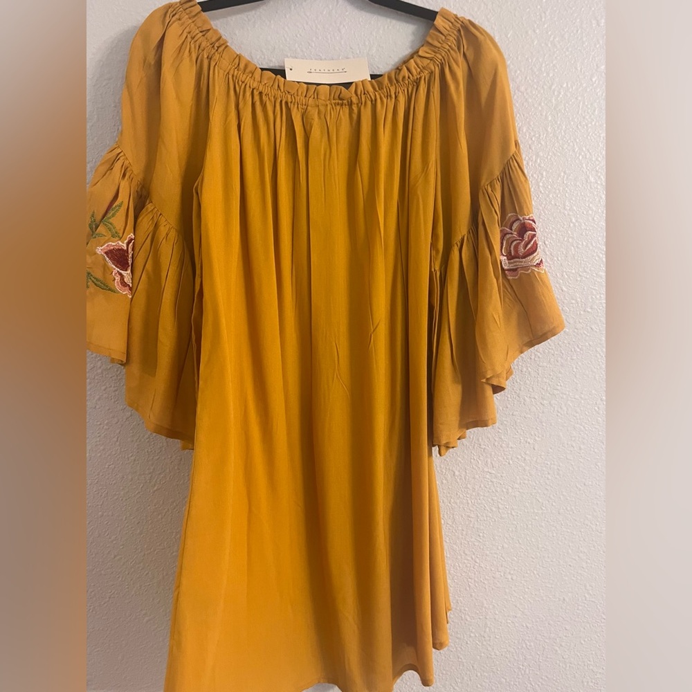 Womans flowy Fall dress in mustard with red rose detailing on the sleeves